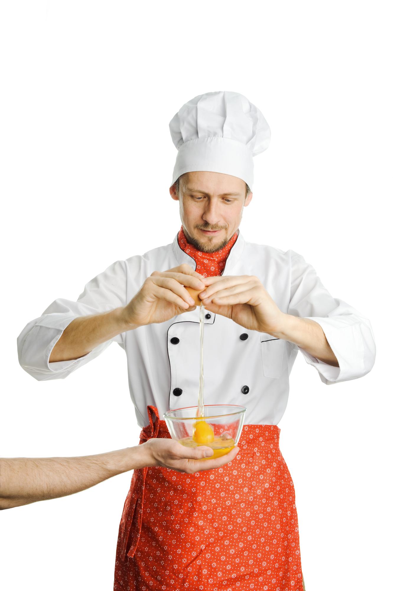 Chef instructing small group in kitchen